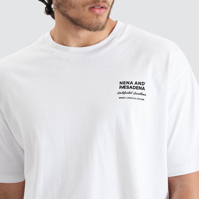 Model Wears Compound Heavy Box Fit Tee Optical White T-Shirts in White - Image 3