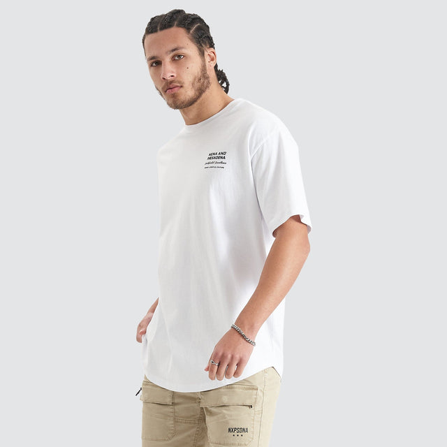 Model Wears Compound Heavy Box Fit Tee Optical White T-Shirts in White - Image 5