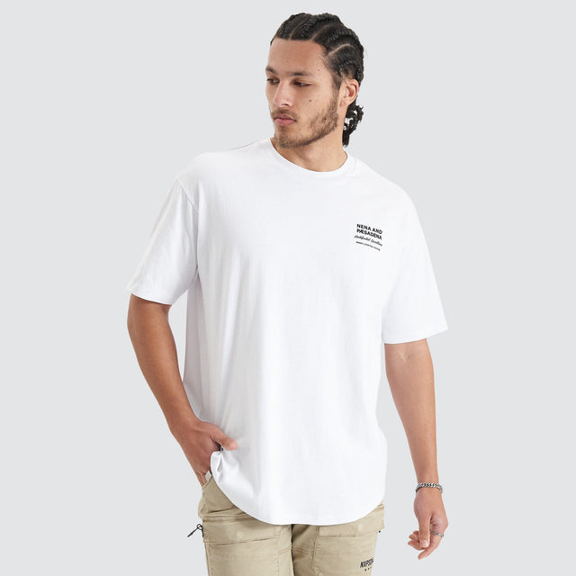 Model Wears Compound Heavy Box Fit Tee Optical White T-Shirts in White - Image 1
