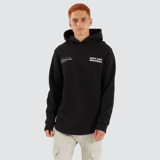 Model Wears Concentric Dual Curved Hoodie Jet Black Hoodies in Black - Image 2