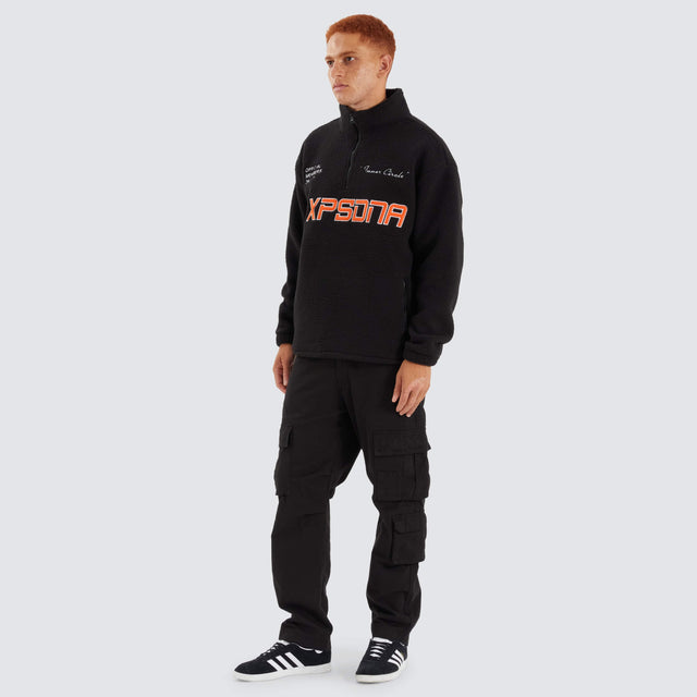 Model Wears Core Pullover Sweater Jet Black Jumpers in Black - Image 4