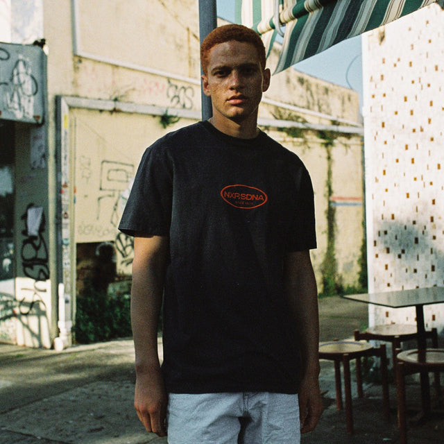 Model Wears Cycle Relaxed Tee Pigment Anthracite Black T-Shirts in Black - Image 3