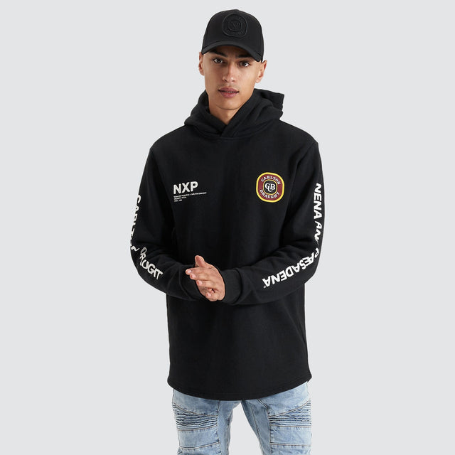Model Wears Drummond Dual Curved Hoodie Jet Black Hoodies in Black - Image 1