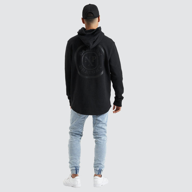 Model Wears Drummond Dual Curved Hoodie Jet Black Hoodies in Black - Image 4