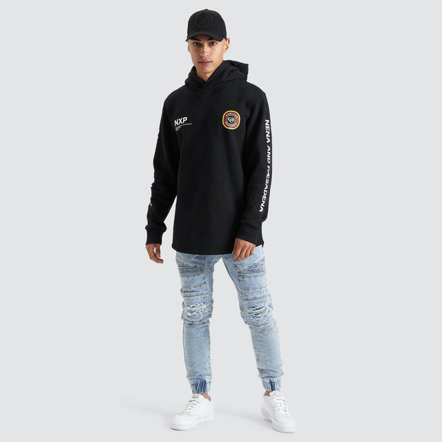 Model Wears Drummond Dual Curved Hoodie Jet Black Hoodies in Black - Image 3
