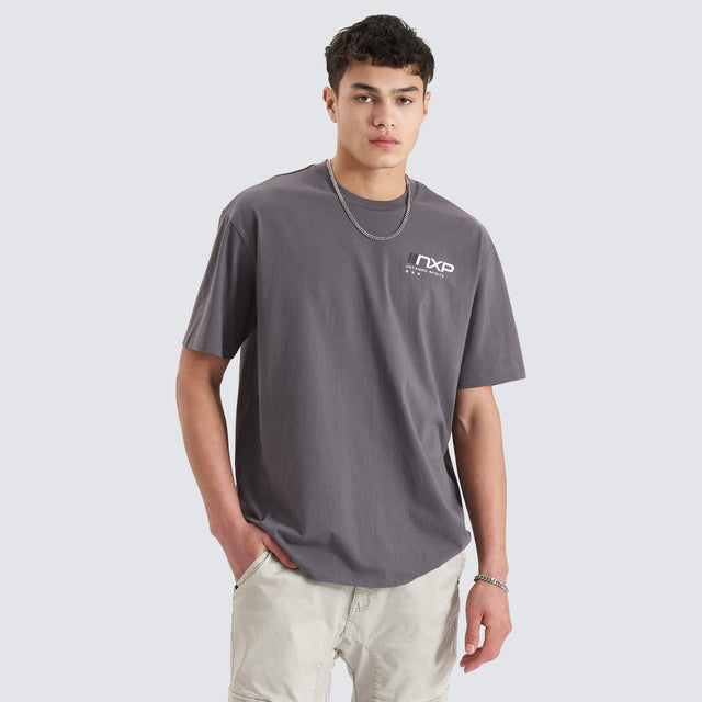 Model Wears Dynamic Heavy Box Fit Tee Asphalt T-Shirts in Grey - Image 1