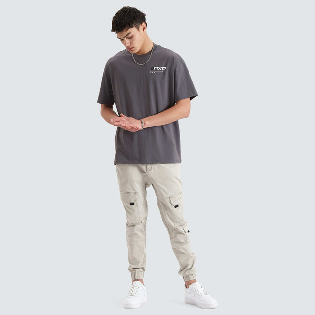 Model Wears Dynamic Heavy Box Fit Tee Asphalt T-Shirts in Grey - Image 3