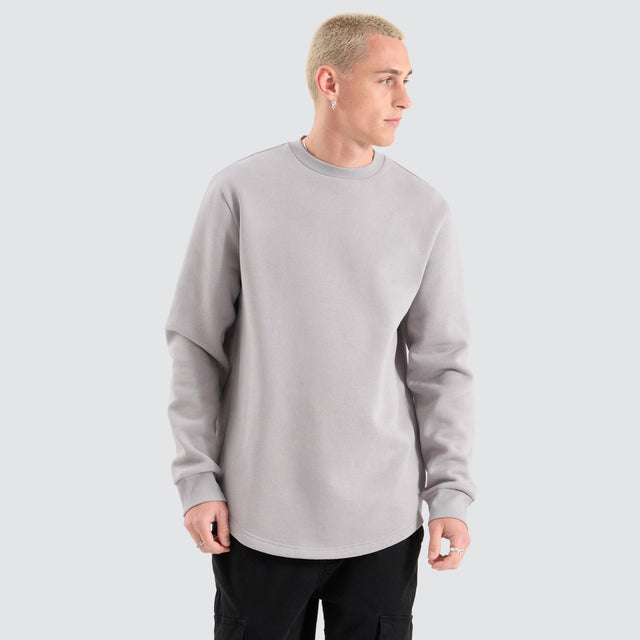 Model Wears Fernie Dual Curved Sweater Alloy Jumpers in Grey - Image 3