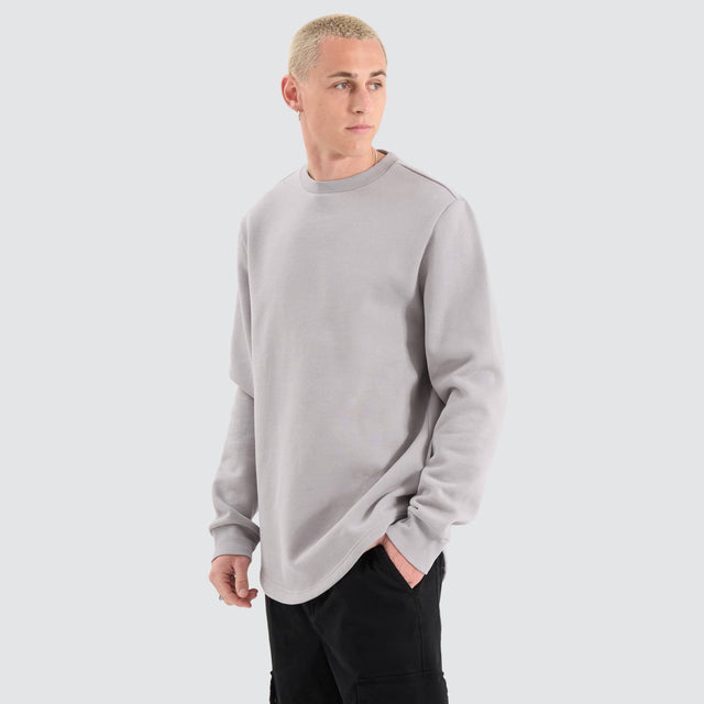 Model Wears Fernie Dual Curved Sweater Alloy Jumpers in Grey - Image 1