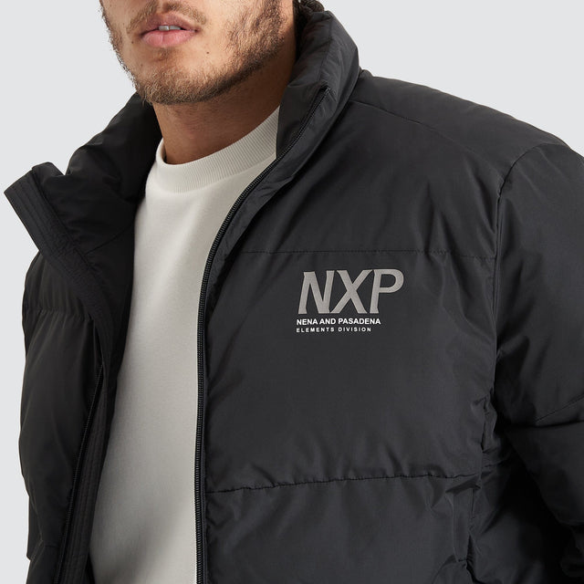 Model Wears Forfeit Puffer Jacket Jet Black Jackets in Black - Image 7
