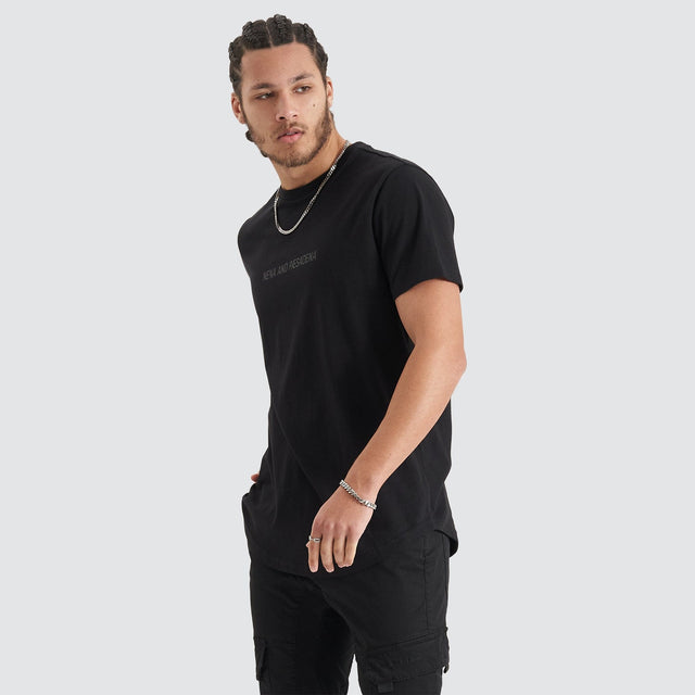 Model Wears Friction Dual Curved Tee Jet Black T-Shirts in Black - Image 6