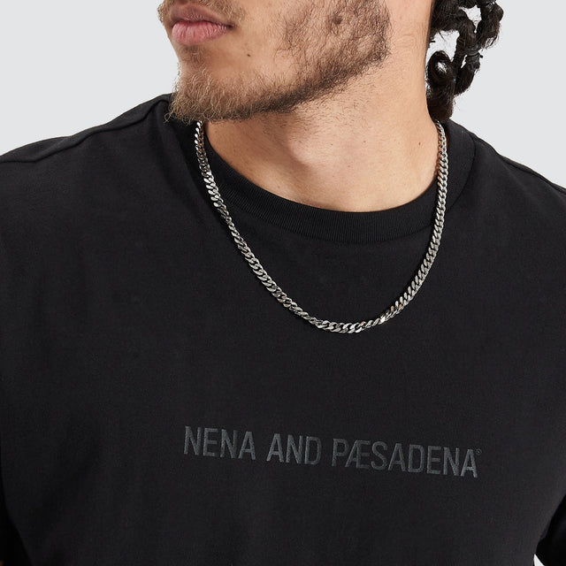 Model Wears Friction Dual Curved Tee Jet Black T-Shirts in Black - Image 2