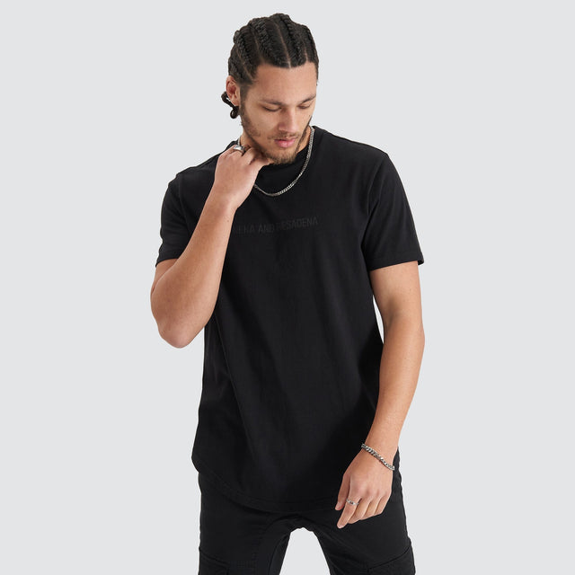 Model Wears Friction Dual Curved Tee Jet Black T-Shirts in Black - Image 4