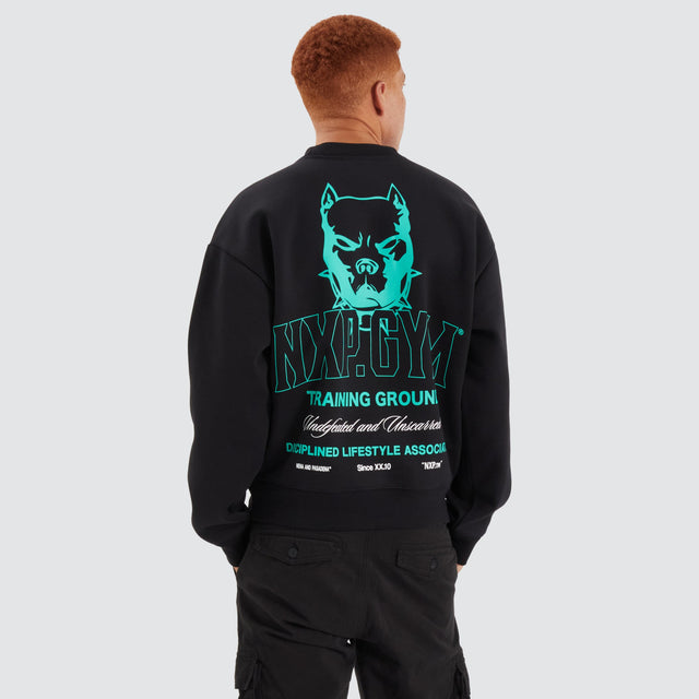 Model Wears Ground Box Fit Sweater Jet Black Jumpers in Black - Image 1