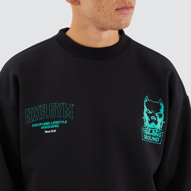 Model Wears Ground Box Fit Sweater Jet Black Jumpers in Black - Image 6