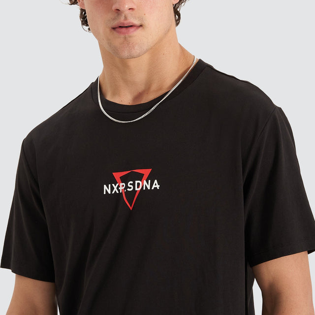 Model Wears International Cape Back Tee Jet Black T-Shirts in Black - Image 3