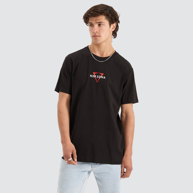 Model Wears International Cape Back Tee Jet Black T-Shirts in Black - Image 7