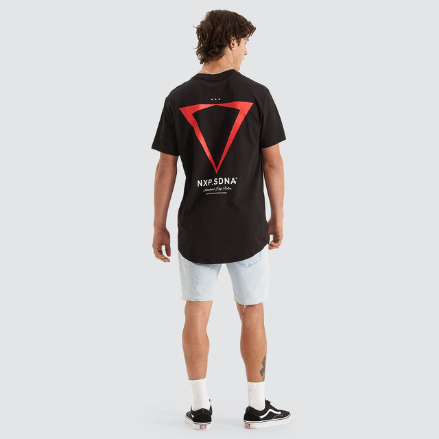 Model Wears International Cape Back Tee Jet Black T-Shirts in Black - Image 6