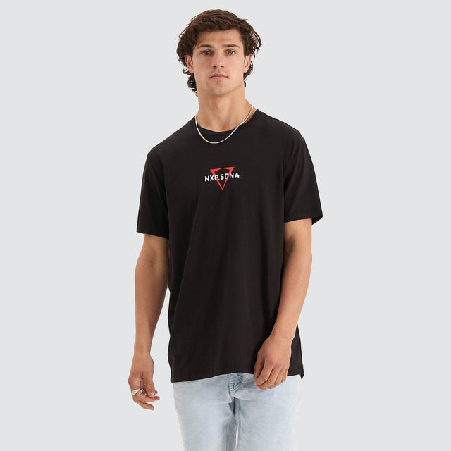Model Wears International Cape Back Tee Jet Black T-Shirts in Black - Image 2