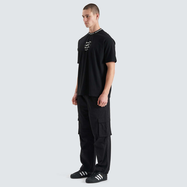 Model Wears Ionic Heavy Box Fit Tee Jet Black T-Shirts in Black - Image 7