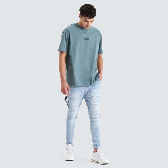 Model Wears Keystone Heavy Box Fit Tee Goblin Blue T-Shirts in Blue - Image 4