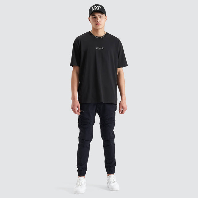 Model Wears Keystone Heavy Box Fit Tee Jet Black T-Shirts in Black - Image 5