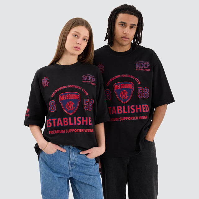 Model Wears Melbourne Demons AFL Mega Loopback Tee Jet Black T-Shirts in Black - Image 2