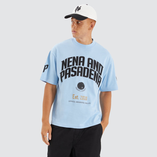 Model Wears Members Loopback Street Tee Placid Blue T-Shirts in Blue - Image 1