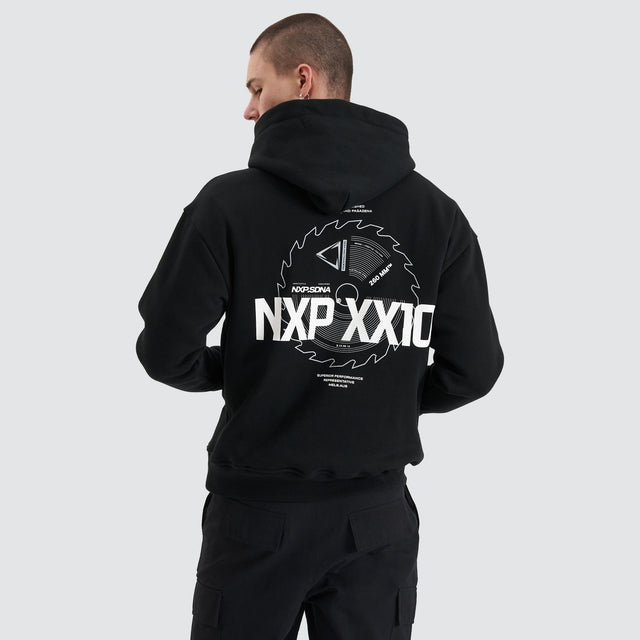 Model Wears Mortar Heavy Relaxed Hoodie Jet Black Jumpers in Black - Image 1