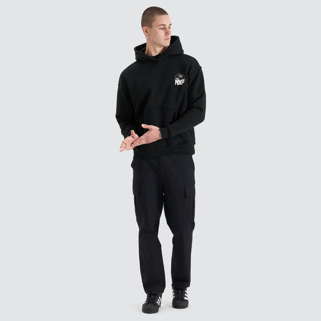 Model Wears Mortar Heavy Relaxed Hoodie Jet Black Jumpers in Black - Image 4