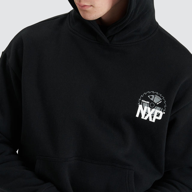 Model Wears Mortar Heavy Relaxed Hoodie Jet Black Jumpers in Black - Image 6