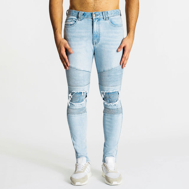 Model Wears Combination Jean 2.0 Canyon Blue Pants in Blue - Image 4