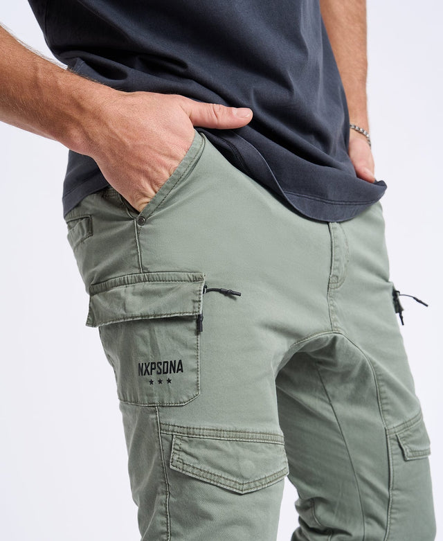 Model Wears Flight 2.0 Pant Oil Green Pants in Green - Image 2
