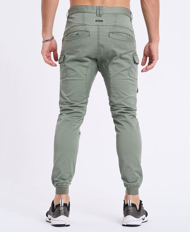 Model Wears Flight 2.0 Pant Oil Green Pants in Green - Image 5