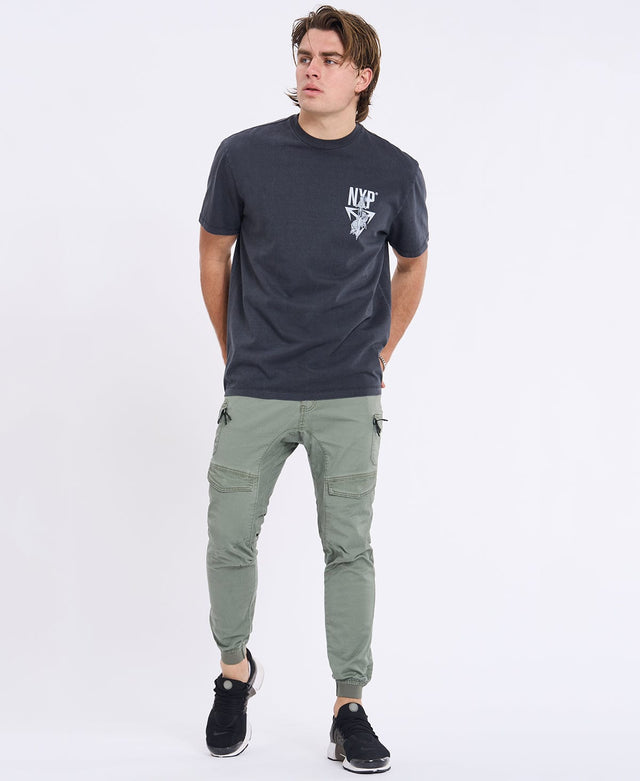 Model Wears Flight 2.0 Pant Oil Green Pants in Green - Image 3