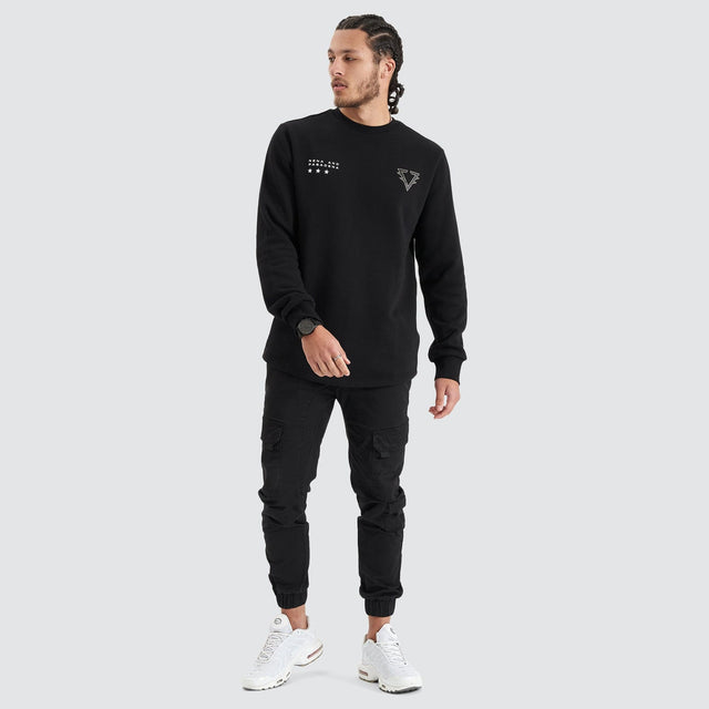 Model Wears Novice Dual Curved Sweater Jet Black Jumpers in Black - Image 4