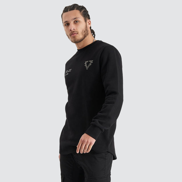 Model Wears Novice Dual Curved Sweater Jet Black Jumpers in Black - Image 6