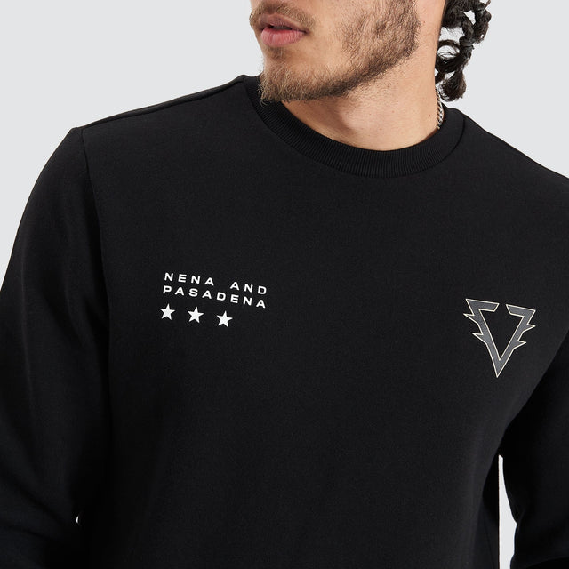 Model Wears Novice Dual Curved Sweater Jet Black Jumpers in Black - Image 3