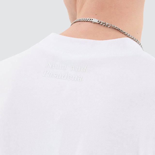 Model Wears Osaka Cube Tee Optical White T-Shirts in White - Image 5