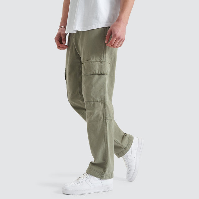 Model Wears Overland Cargo Pant Sage Pants in Green - Image 5