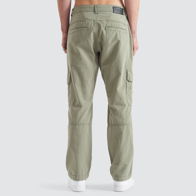 Model Wears Overland Cargo Pant Sage Pants in Green - Image 10