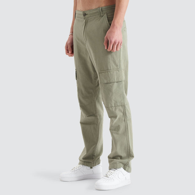Model Wears Overland Cargo Pant Sage Pants in Green - Image 9