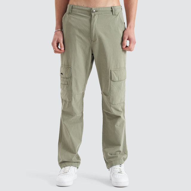 Model Wears Overland Cargo Pant Sage Pants in Green - Image 8