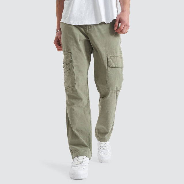Model Wears Overland Cargo Pant Sage Pants in Green - Image 4