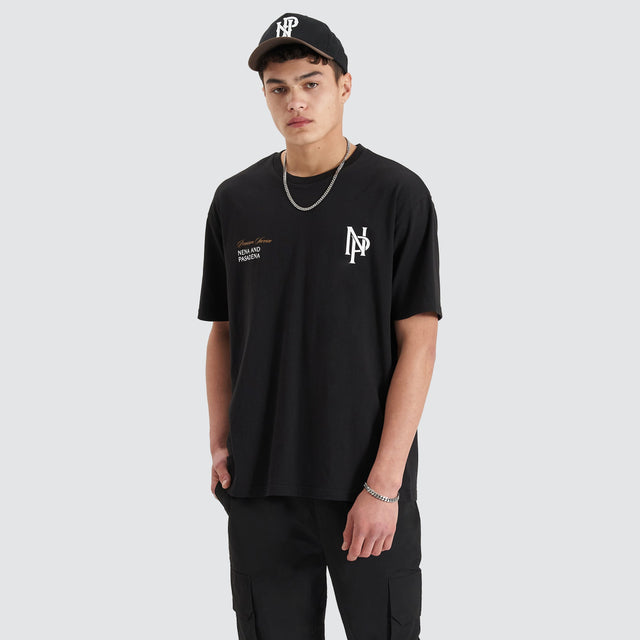 Model Wears Petronas Heavy Box Fit Tee Jet Black T-Shirts in Black - Image 2