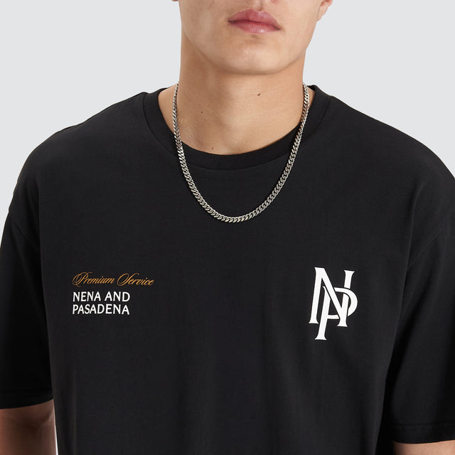 Model Wears Petronas Heavy Box Fit Tee Jet Black T-Shirts in Black - Image 3