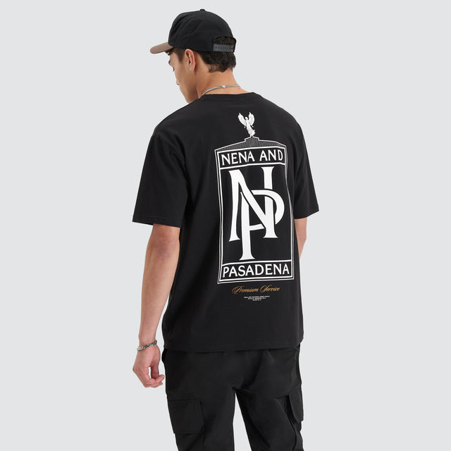 Model Wears Petronas Heavy Box Fit Tee Jet Black T-Shirts in Black - Image 1