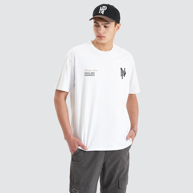 Model Wears Petronas Heavy Box Fit Tee Optical White T-Shirts in White - Image 1