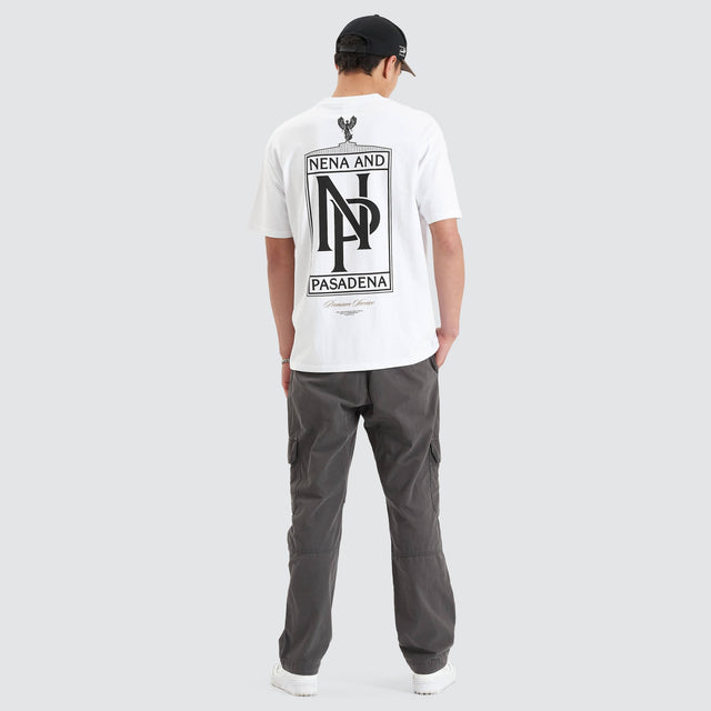 Model Wears Petronas Heavy Box Fit Tee Optical White T-Shirts in White - Image 6