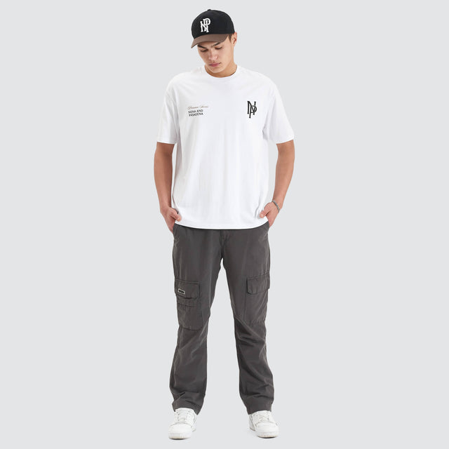 Model Wears Petronas Heavy Box Fit Tee Optical White T-Shirts in White - Image 5